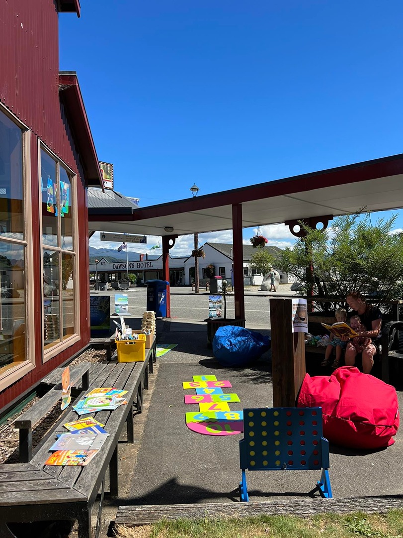 Activities and games for children on a sunny day outside Reefton Library 
