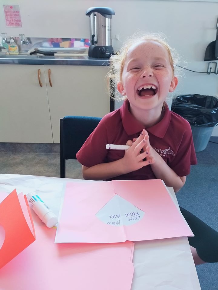 A child laughing at the Tuesday Club Event